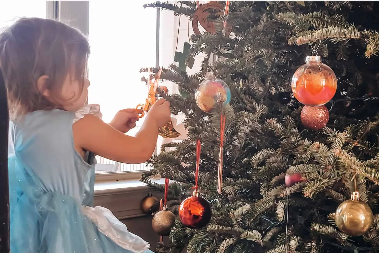 _Christmas Traditions to Start on Baby's First Christmas - Decorate the Tree
