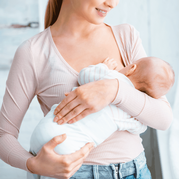 newborn spits up when lying down