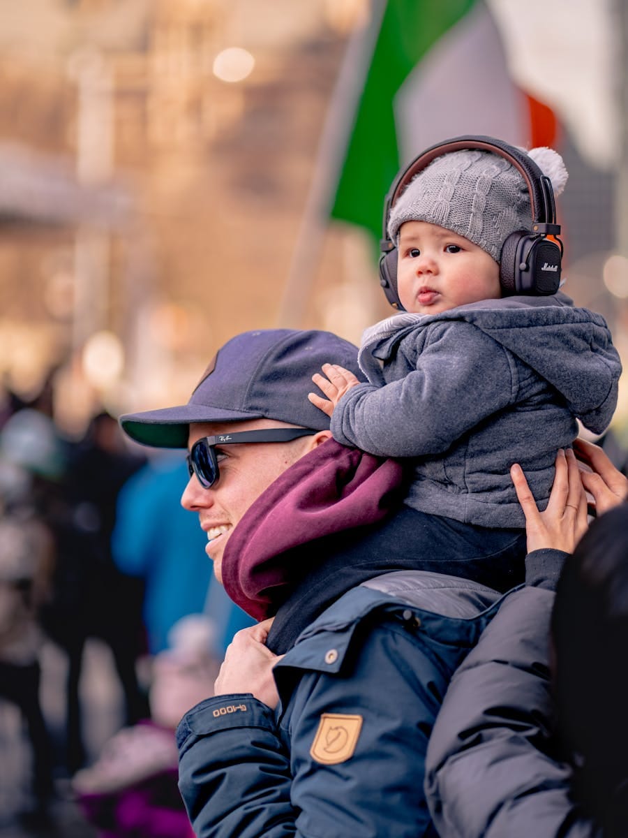 Dad and son bond at an outdoor event in Toronto, showcasing family togetherness.