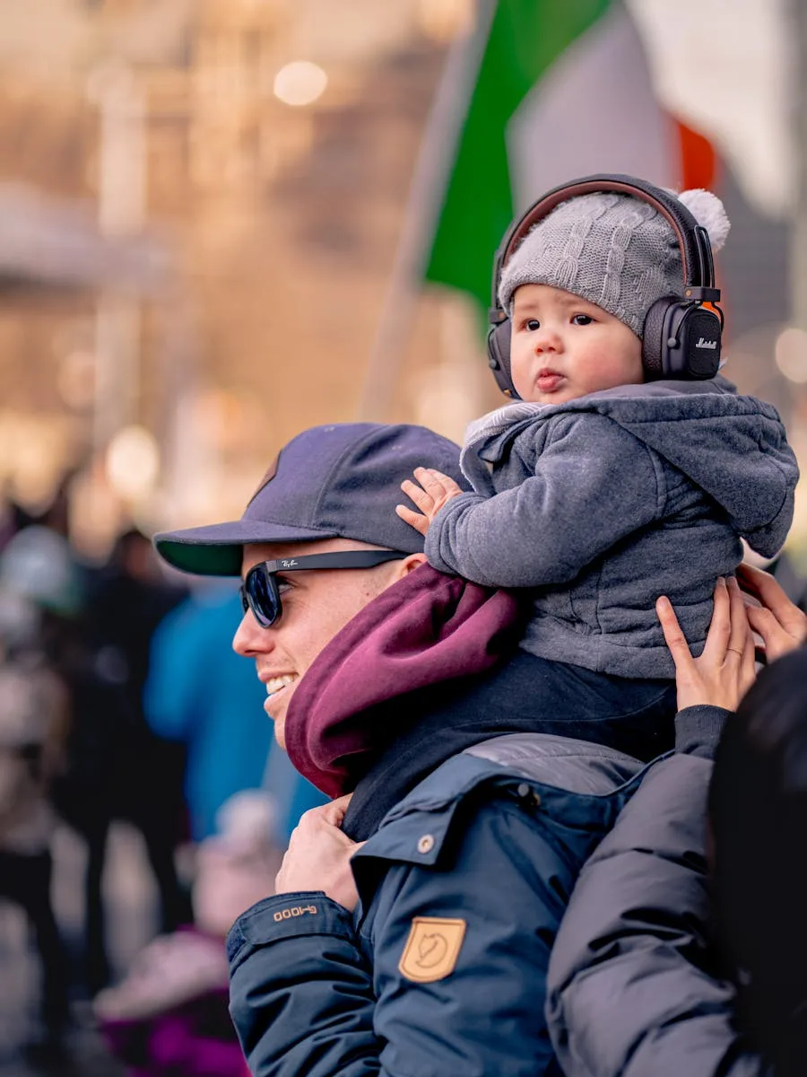 Dad and son bond at an outdoor event in Toronto, showcasing family togetherness.